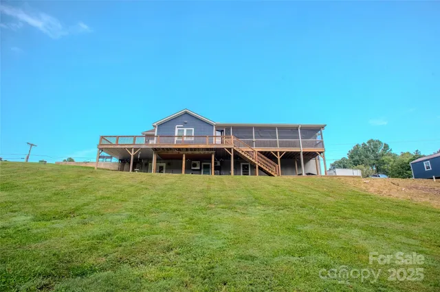 a view of a balcony with furniture and wooden floor