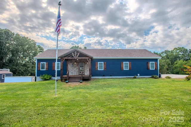 a view of a swimming pool with a yard