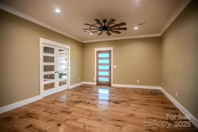 a bathroom with a sink toilet vanity and shower