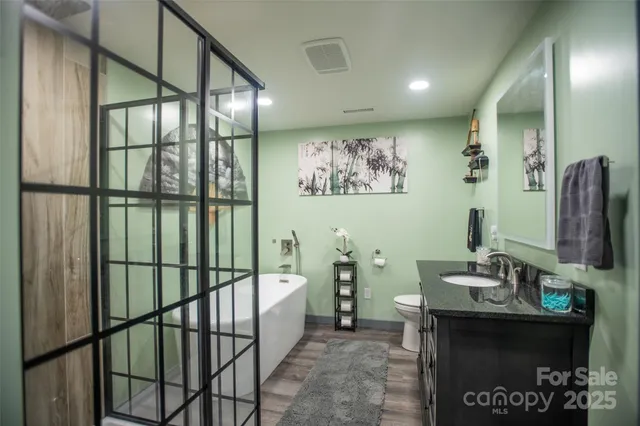 a view of a swimming pool with a yard and outdoor seating