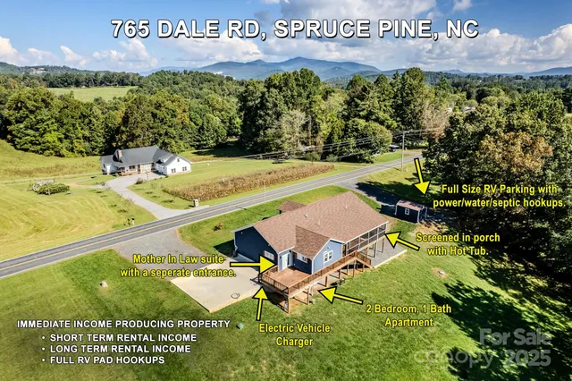 a kitchen with stainless steel appliances granite countertop a sink a stove and a wooden floors