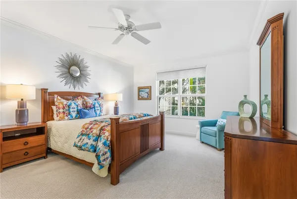 a bed room with a bed and a window