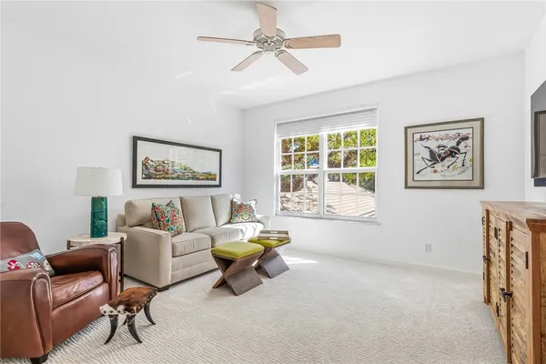 a living room with furniture and a window