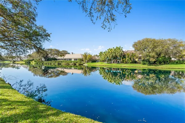 a view of lake with green space