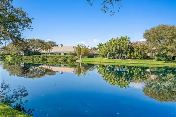 a view of a lake with a big yard