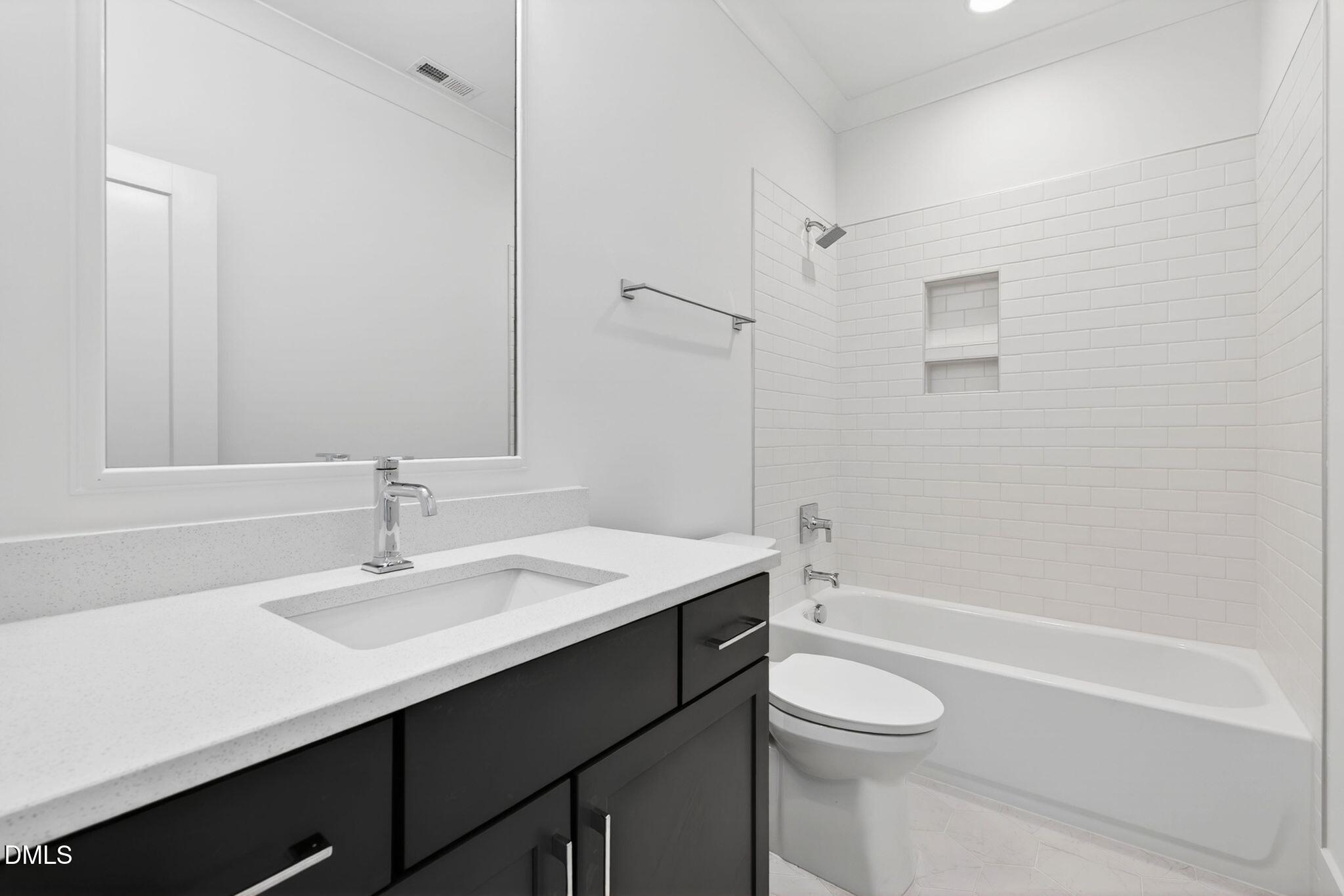 3340 Colby Chase Drive Apex, NC 27539 - Photo 51 of 80 a bathroom with a sink a toilet and shower