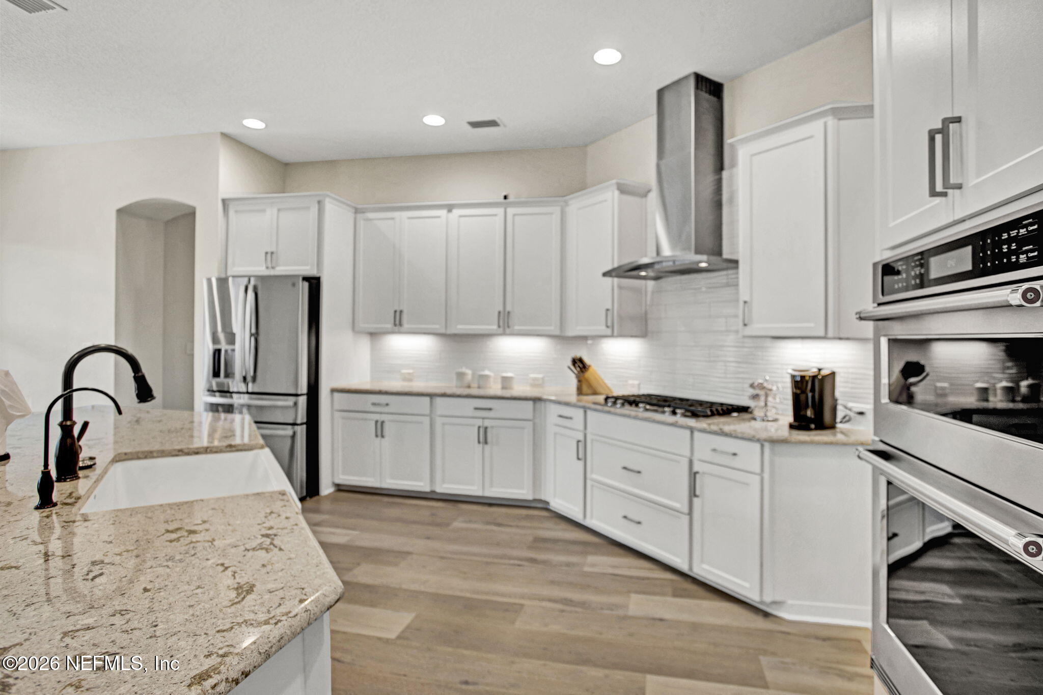 77 Manor Lane St. Johns, FL 32259 - Photo 11 of 41 a kitchen with granite countertop a sink stainless steel appliances and cabinets
