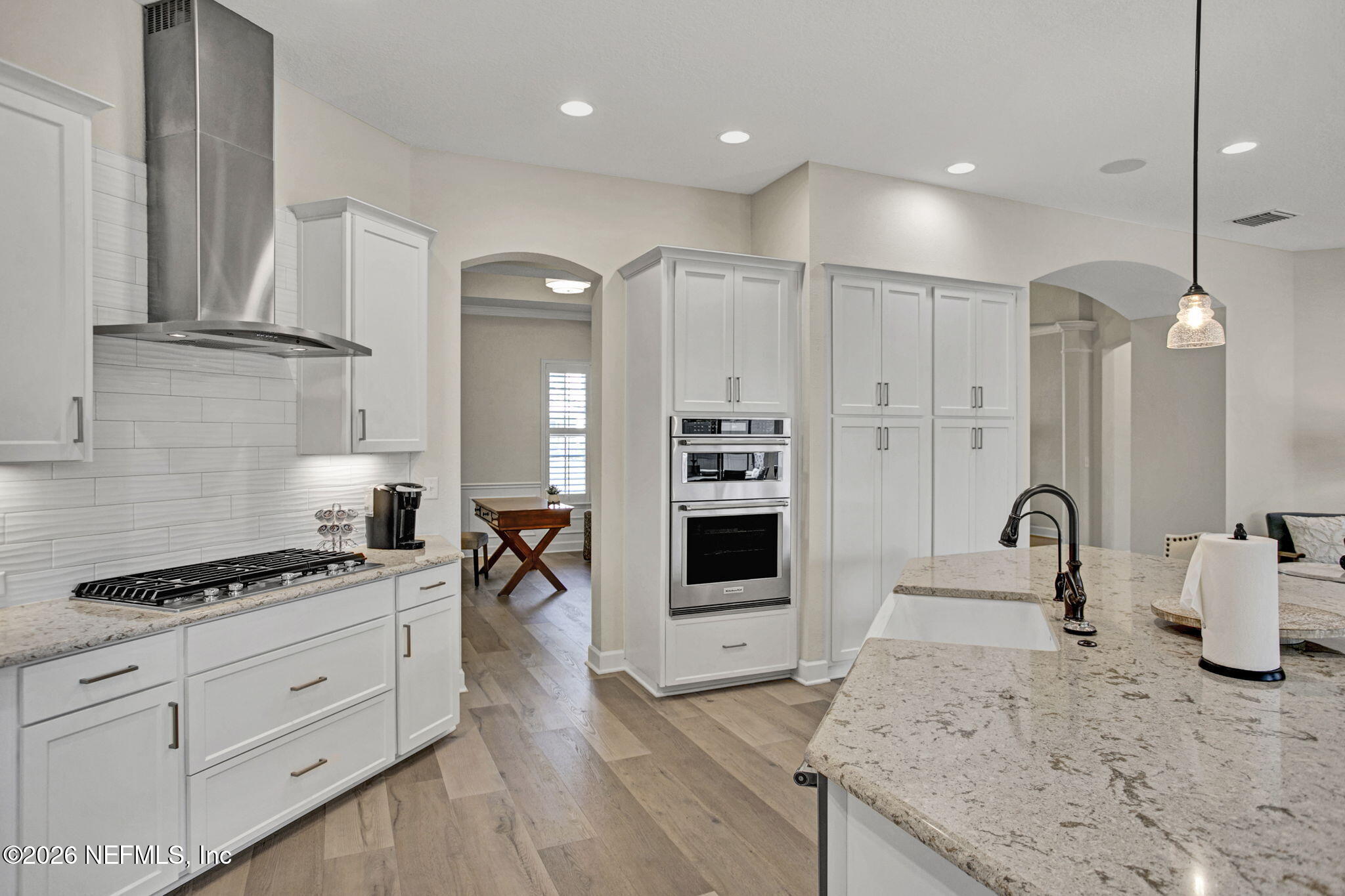 77 Manor Lane St. Johns, FL 32259 - Photo 13 of 41 a kitchen with granite countertop a stove a sink and a refrigerator