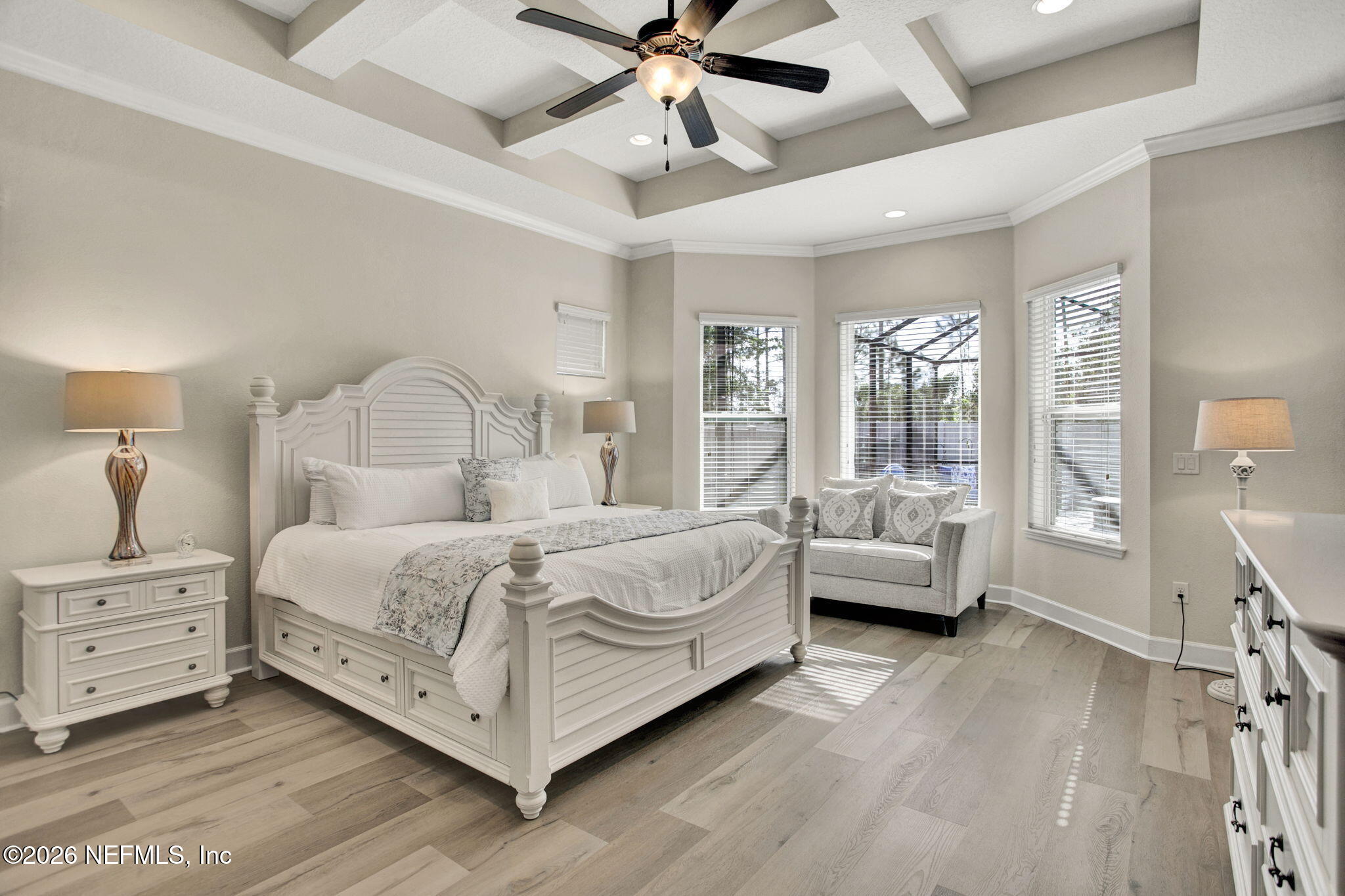 77 Manor Lane St. Johns, FL 32259 - Photo 16 of 41 a bedroom with a bed and a chandelier fan