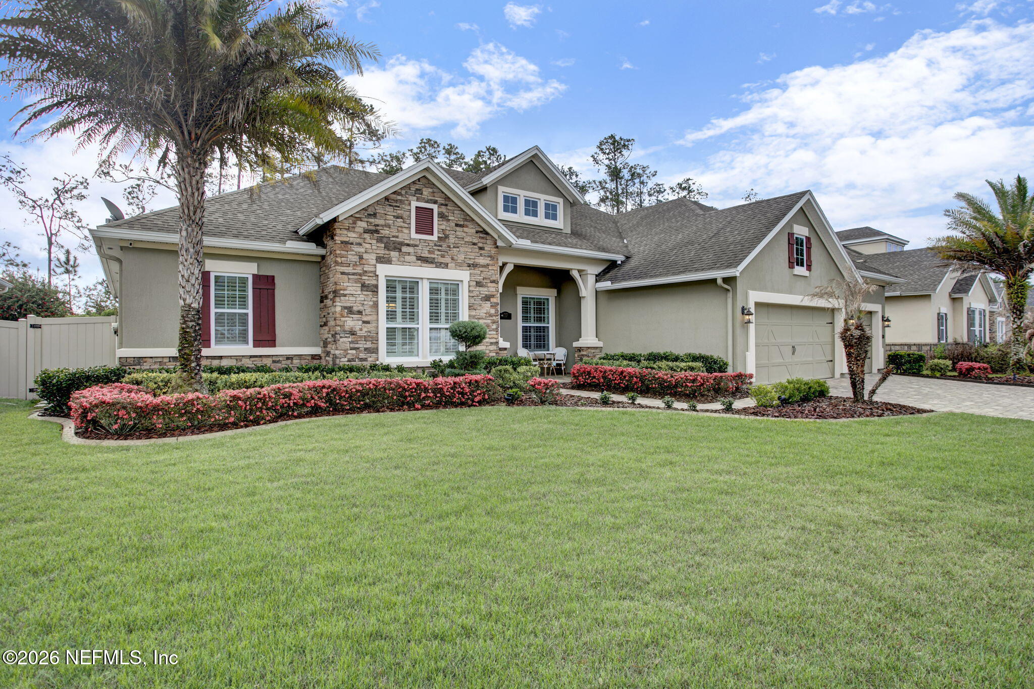 77 Manor Lane St. Johns, FL 32259 - Photo 2 of 41 a front view of house with yard and green space