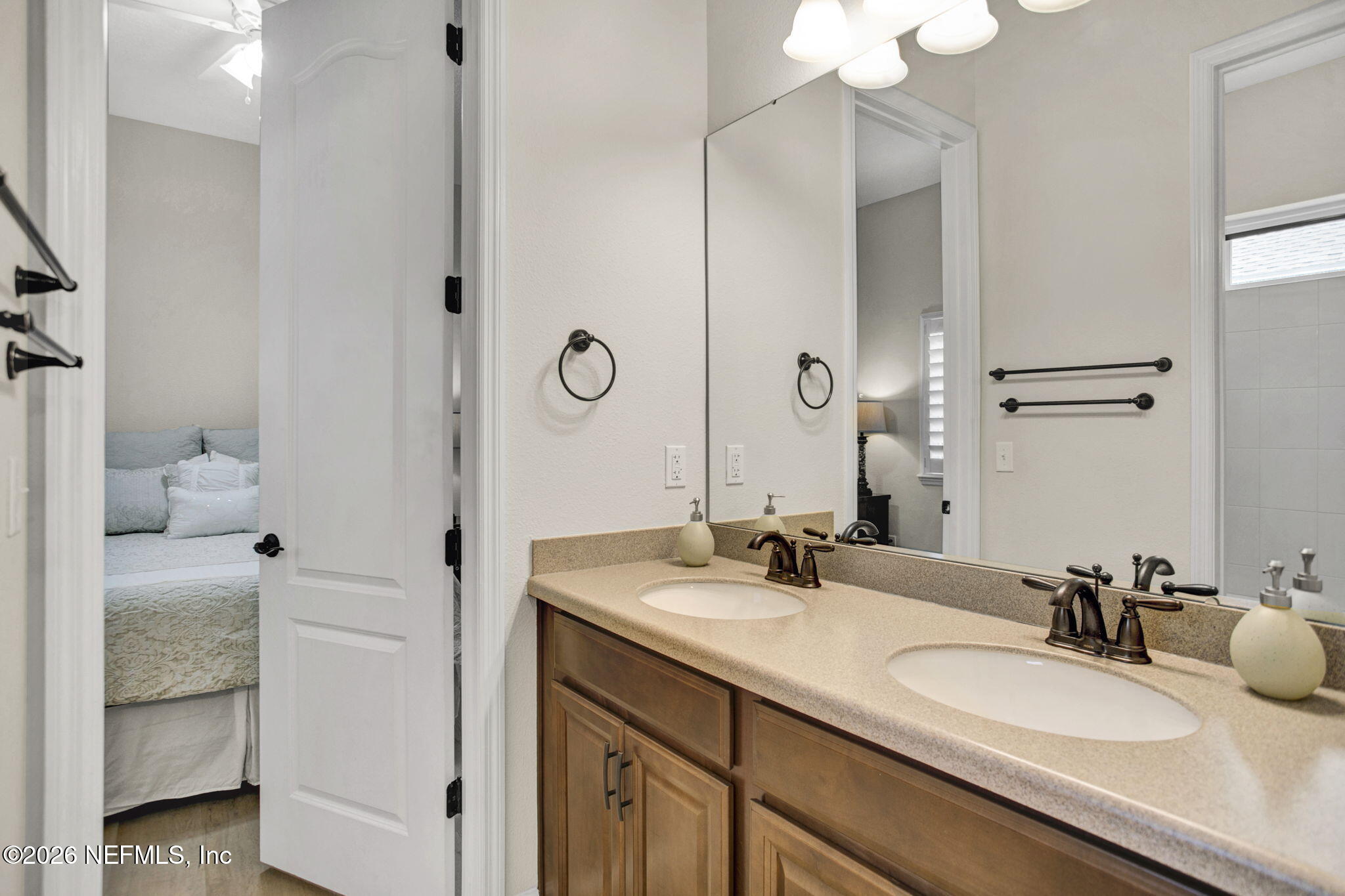 77 Manor Lane St. Johns, FL 32259 - Photo 25 of 41 a bathroom with a granite countertop sink and a mirror