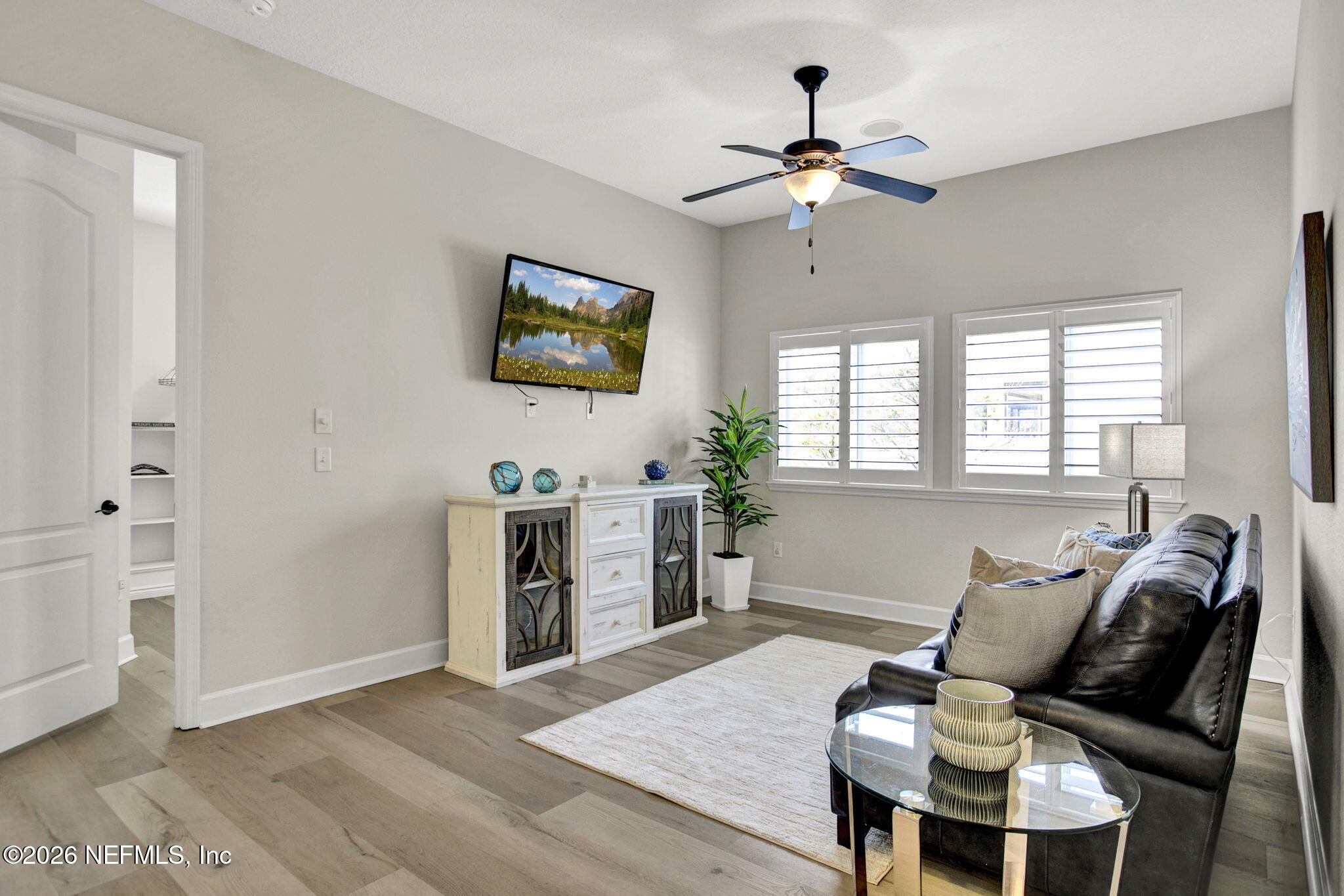 77 Manor Lane St. Johns, FL 32259 - Photo 27 of 41 a living room with furniture and a flat screen tv