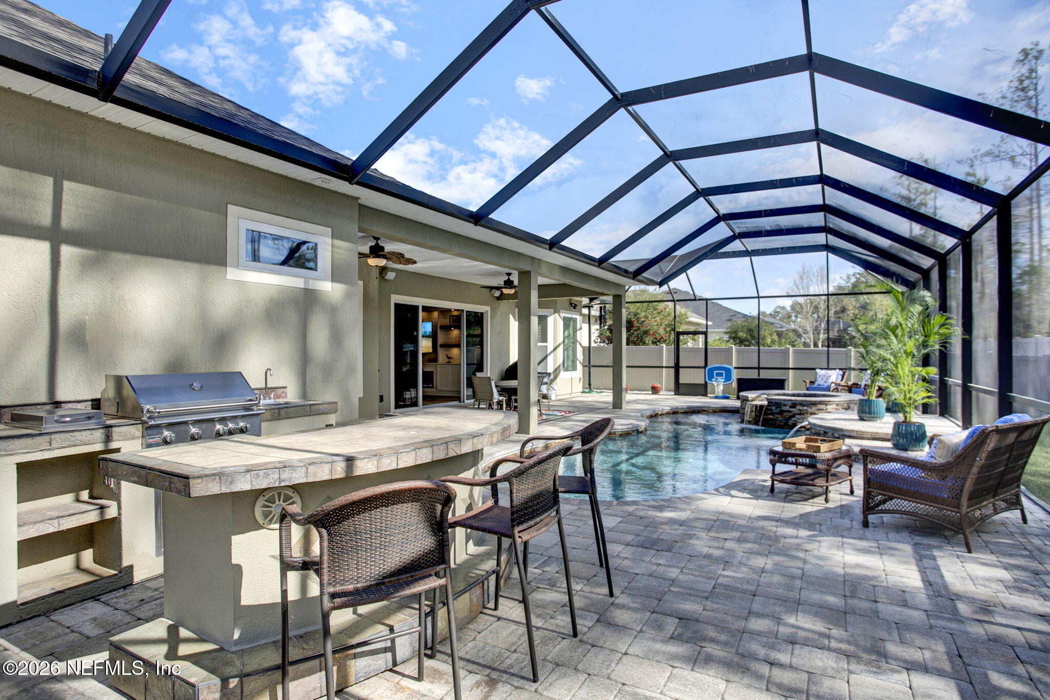 77 Manor Lane St. Johns, FL 32259 - Photo 30 of 41 a view of a dining table and chairs in the patio