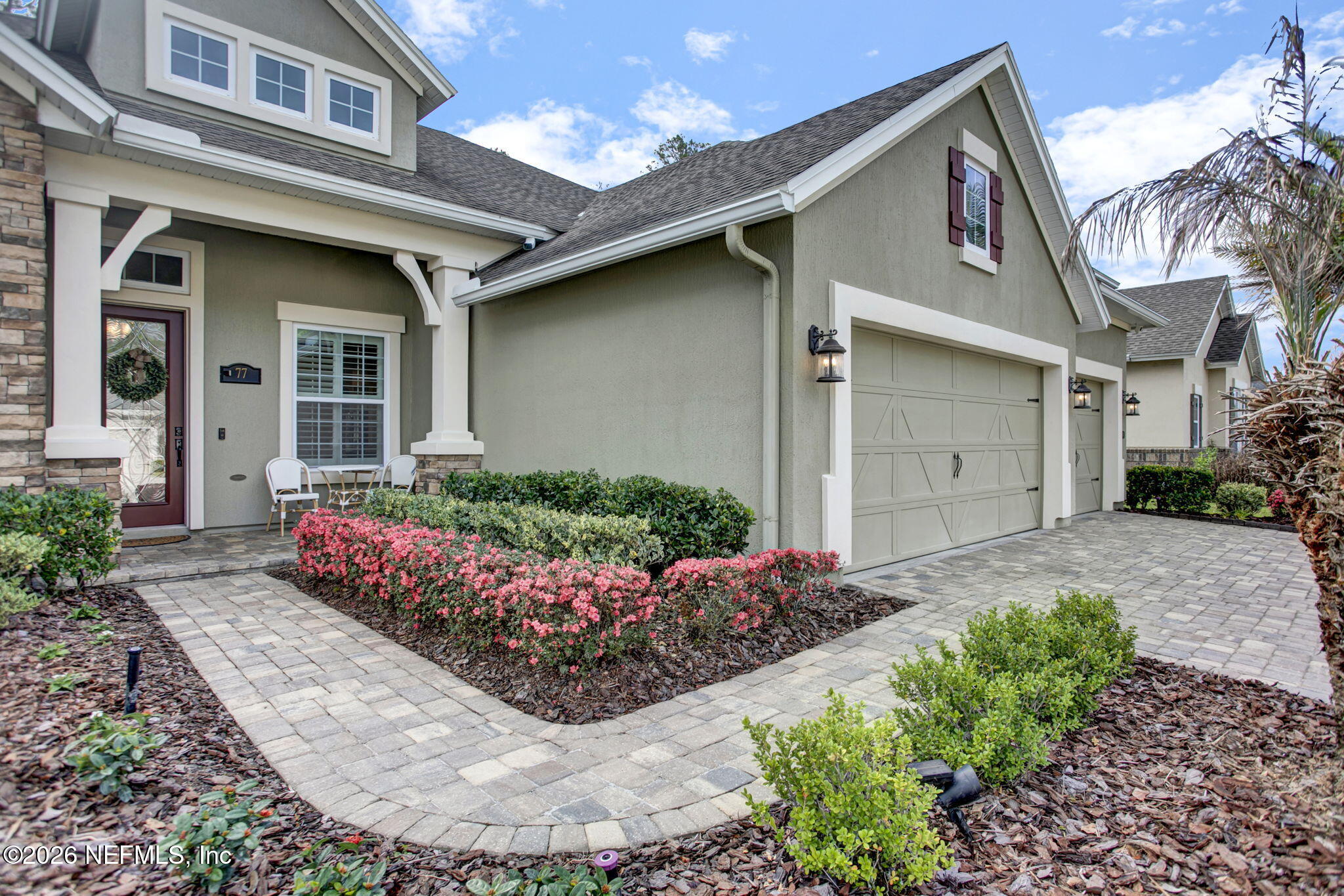 77 Manor Lane St. Johns, FL 32259 - Photo 3 of 41 a front view of a house with a garden
