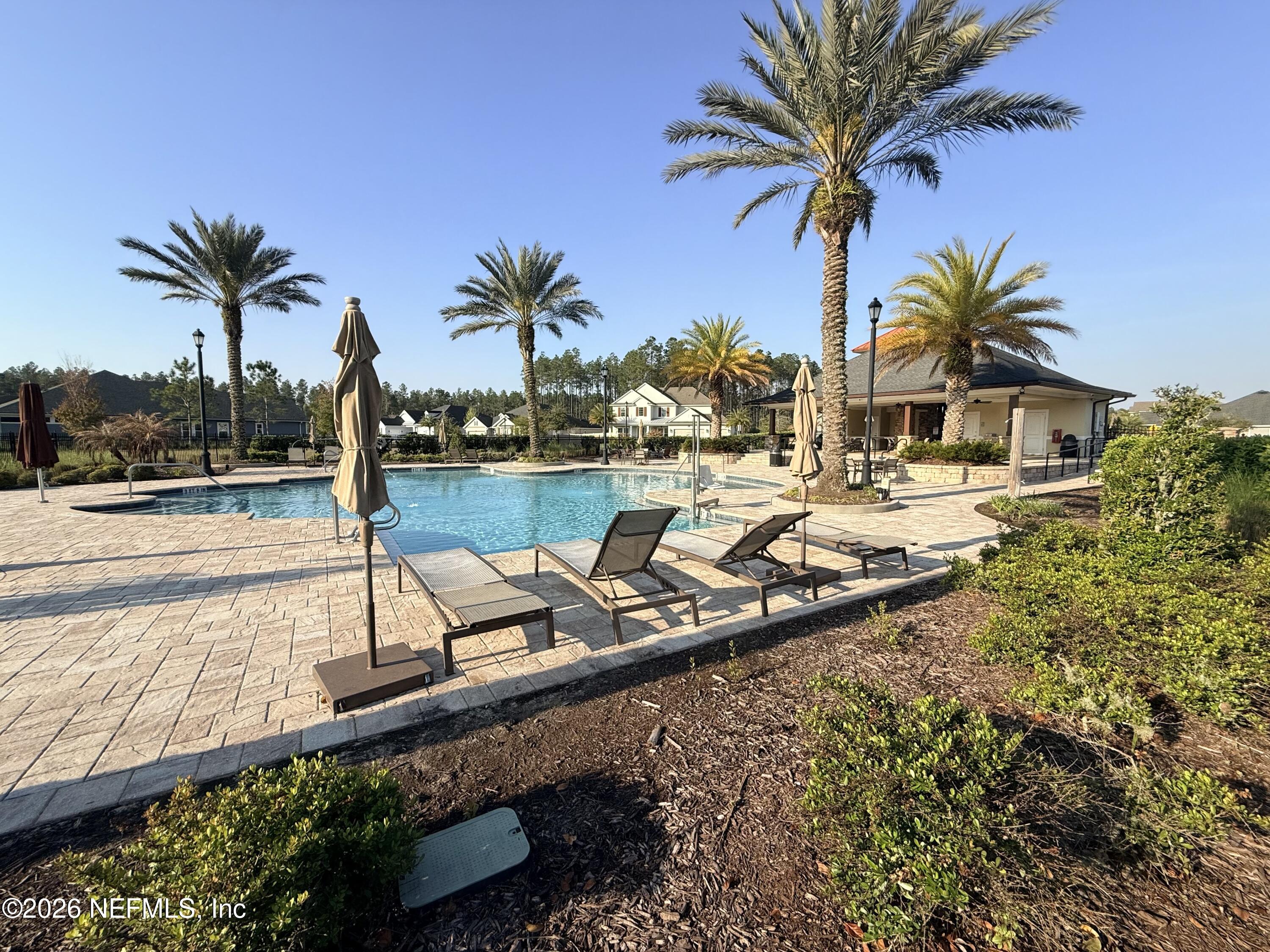 77 Manor Lane St. Johns, FL 32259 - Photo 37 of 41 a view of a ocean with a lounge chairs