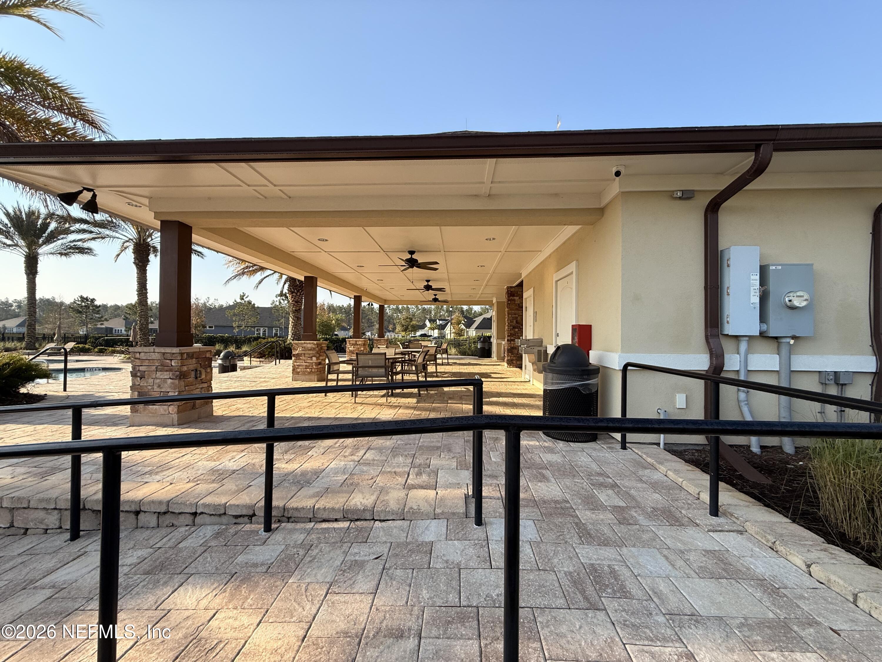 77 Manor Lane St. Johns, FL 32259 - Photo 39 of 41 a view of a patio with table and chairs