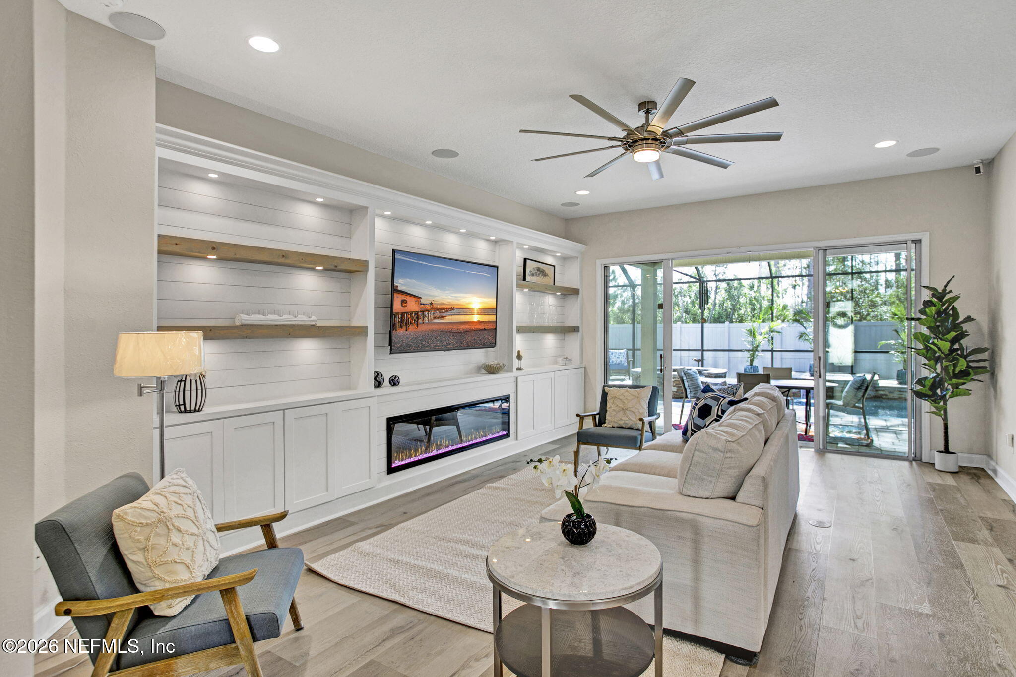 77 Manor Lane St. Johns, FL 32259 - Photo 10 of 41 a living room with furniture and a flat screen tv