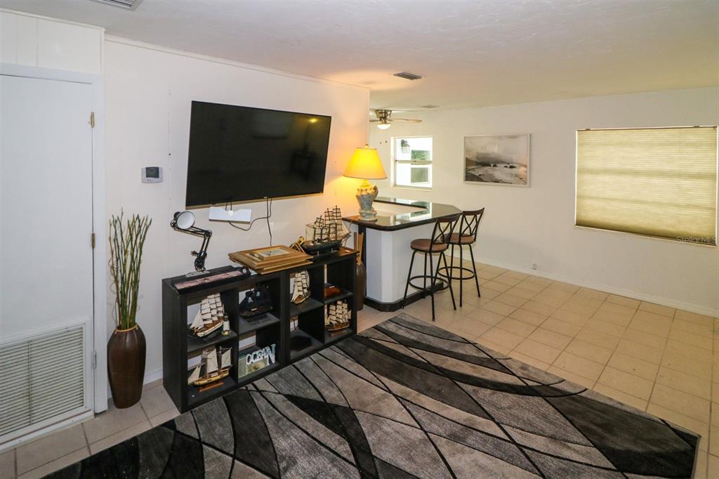 3580 Swanee Road Port Charlotte, FL 33980 - Photo 5 of 22 a living room with furniture and a flat screen tv