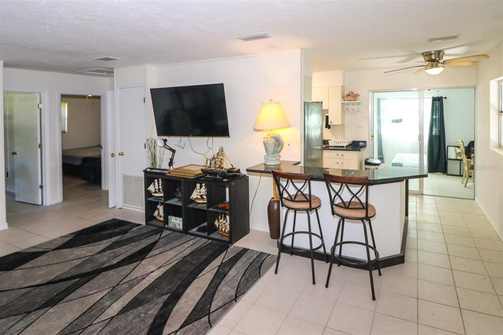 3580 Swanee Road Port Charlotte, FL 33980 - Photo 6 of 22 a living room with furniture and a flat screen tv