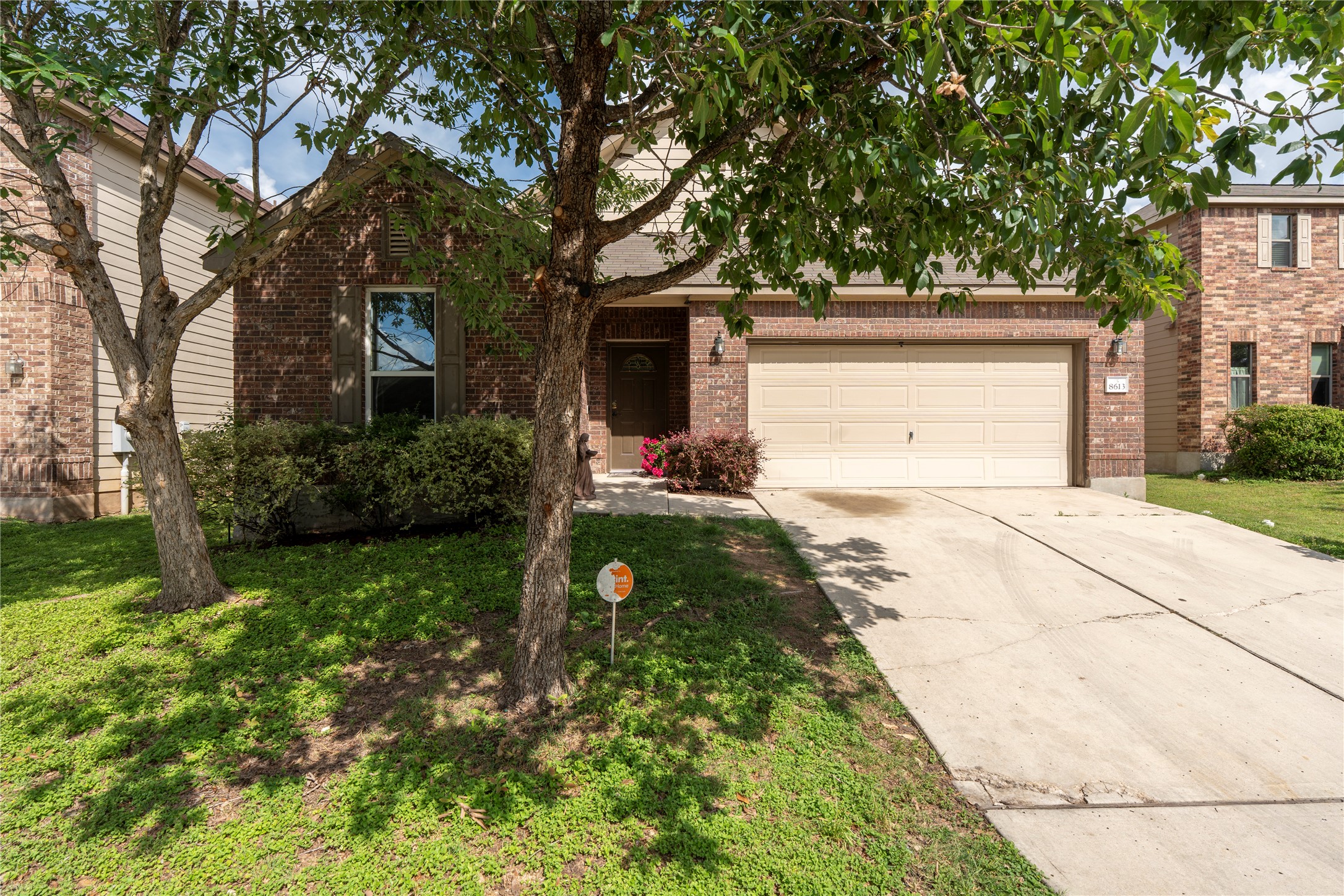 8613 Capitol View Drive Austin, TX 78747 - Photo 1 of 33 A classic brick exterior offers enduring curb appeal and a welcoming facade, framed by mature trees.
