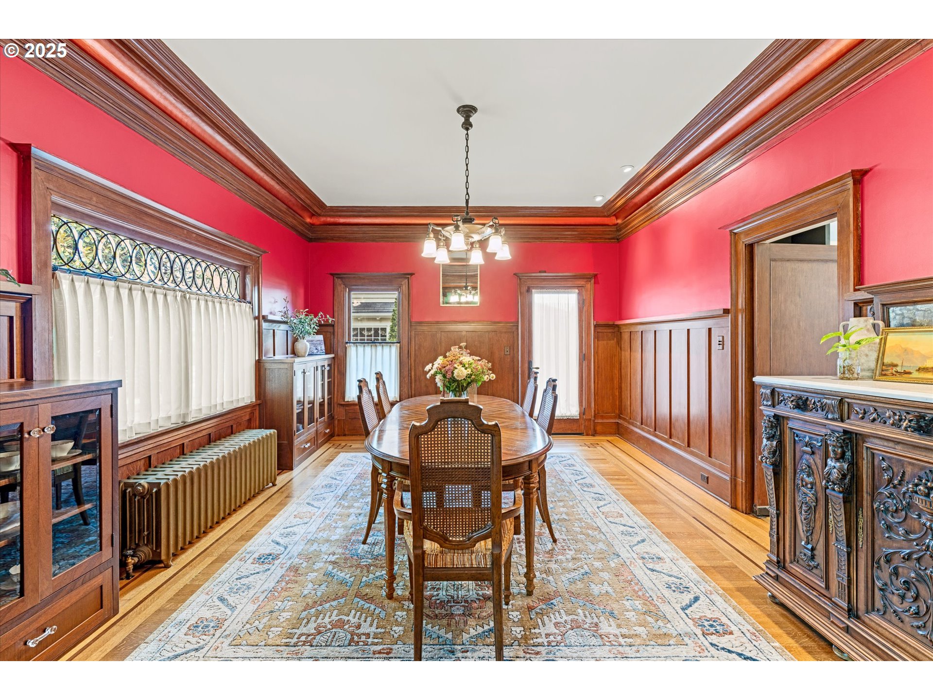 1408 Northeast Knott Street Portland, OR 97212 - Photo 11 of 48 a dining room with furniture a chandelier and wooden floor