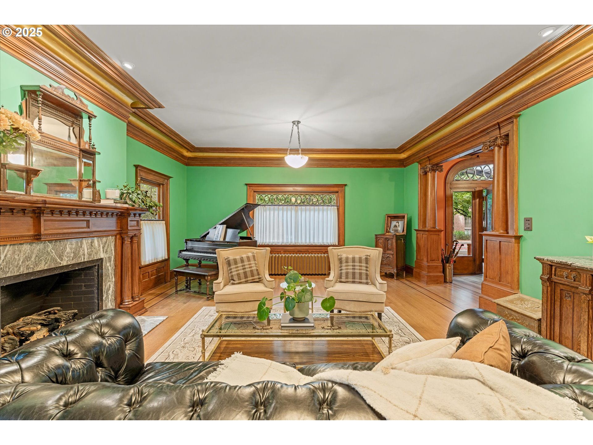 1408 Northeast Knott Street Portland, OR 97212 - Photo 9 of 48 a living room with furniture a fireplace and a chandelier