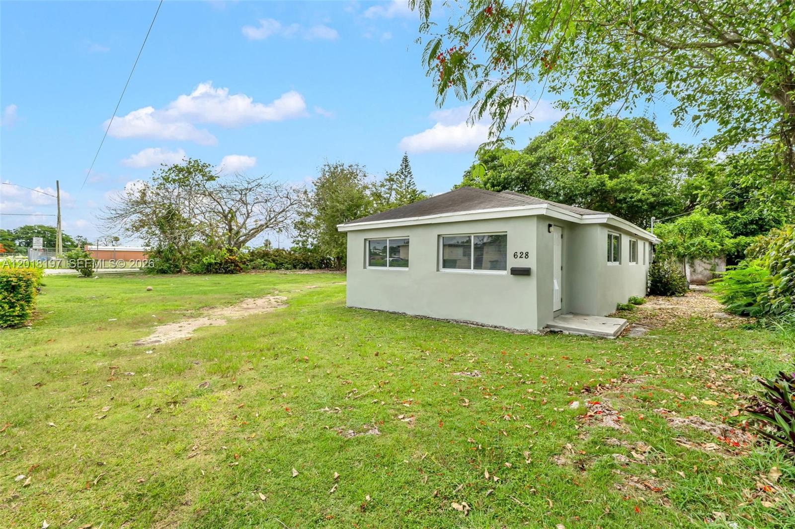 628 Southwest 8th Avenue Homestead, FL 33030 - Photo 3 of 25 a view of a house with a backyard