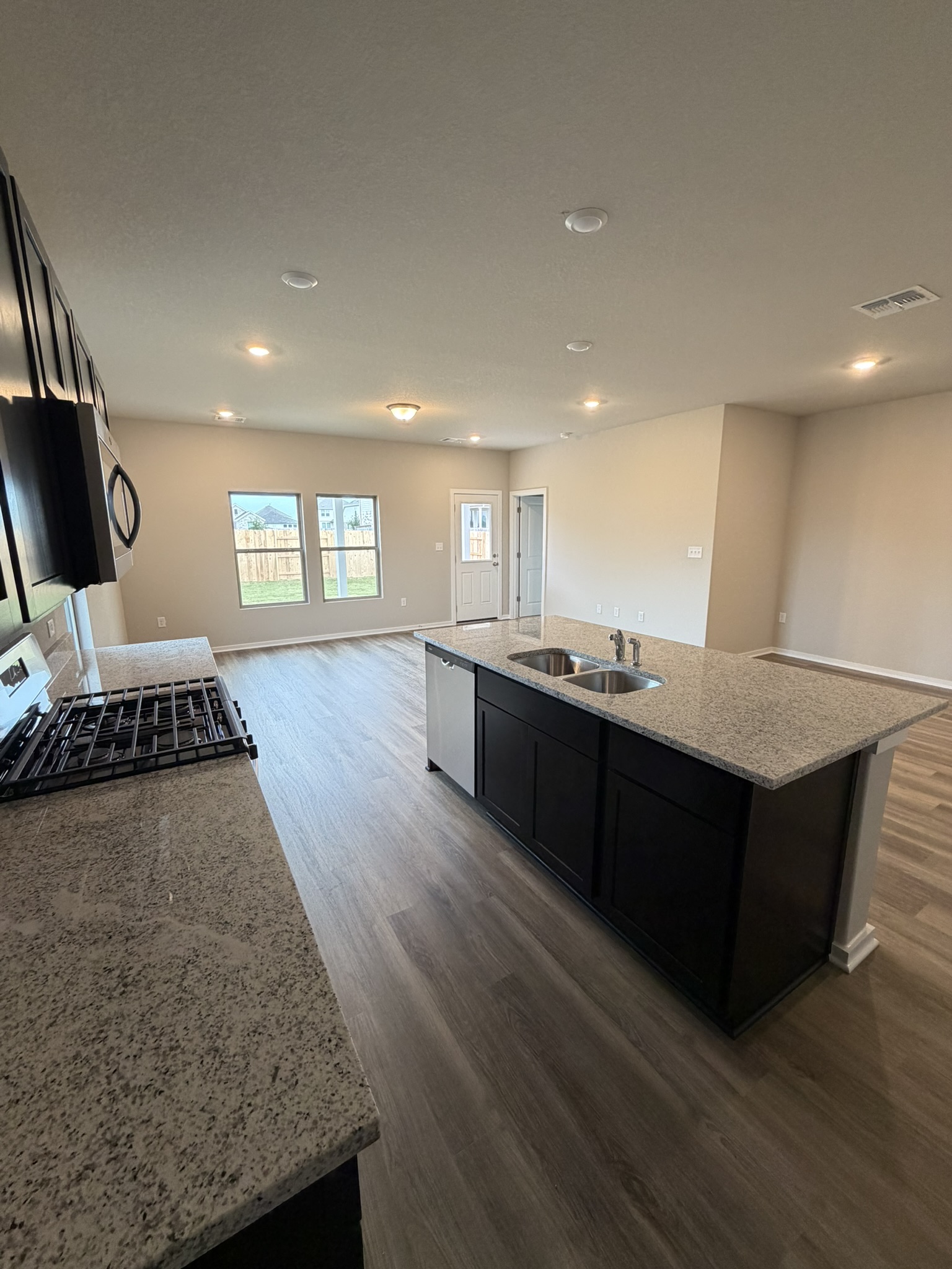 13717 Ryan Range Lane Elgin, TX 78621 - Photo 18 of 20 From Kitchen to Open Floorplan