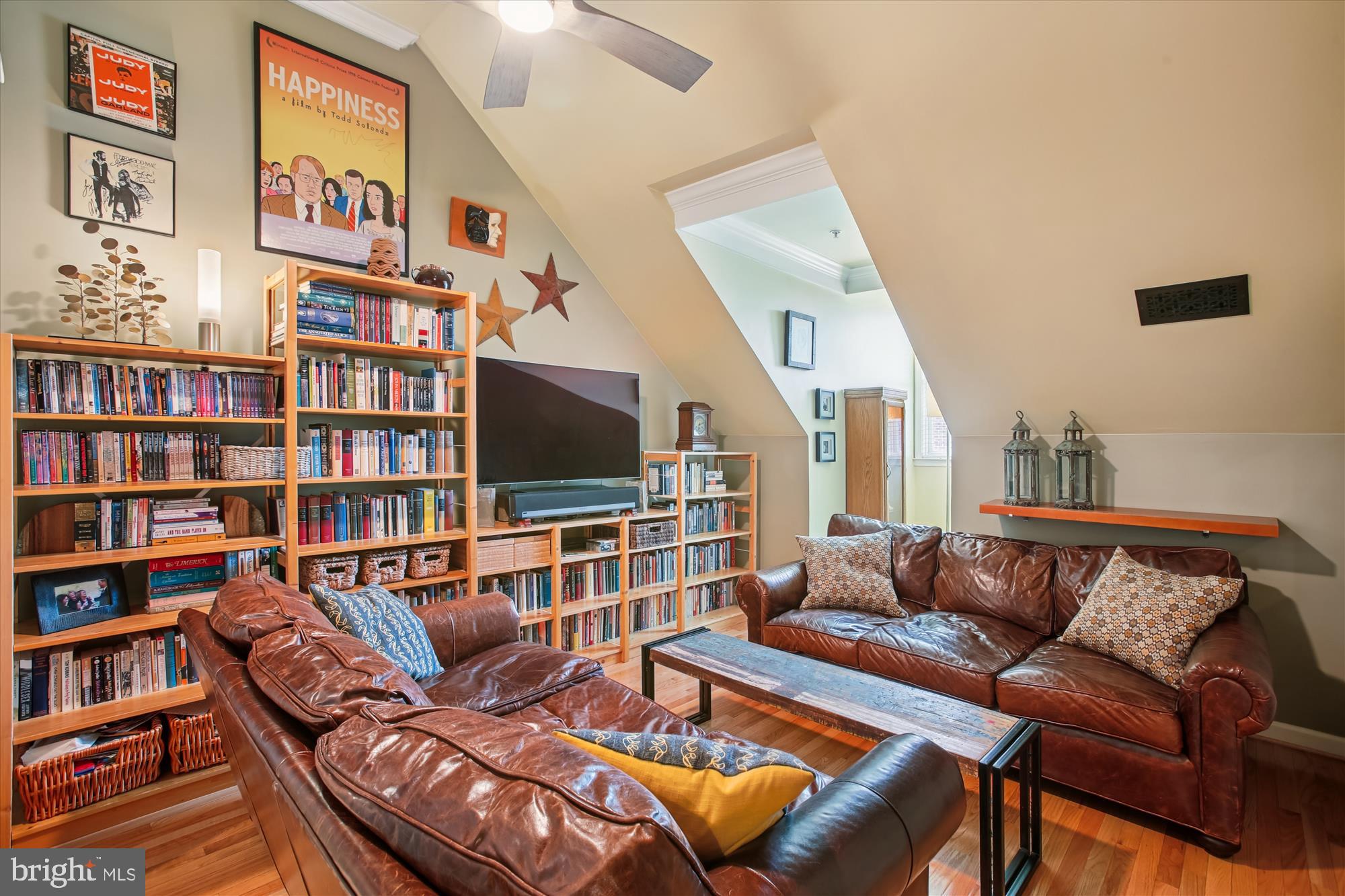 703 Capitol Square Place Southwest Washington, DC 20024 - Photo 44 of 66 a living room with furniture a flat screen tv and a book shelf