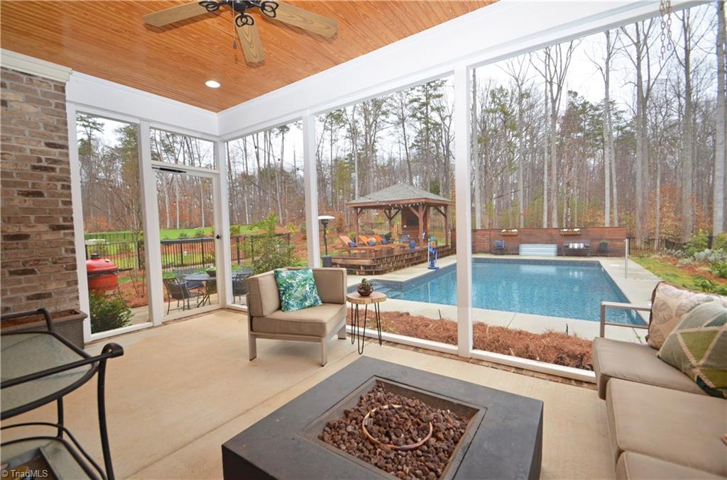 5578 Salem View Road Pfafftown, NC 27040 - Photo 19 of 48 Beautiful screened porch overlooking the back yard and pool.