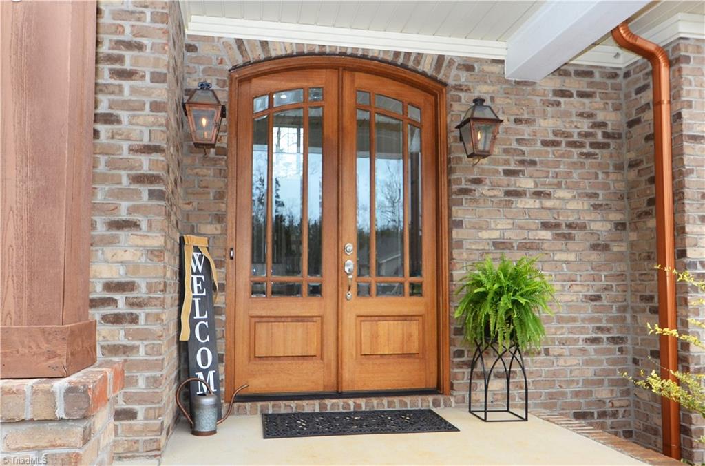 5578 Salem View Road Pfafftown, NC 27040 - Photo 3 of 48 Beautiful double front door with natural gas lanterns. Shutters, beams, and wood trim have all been freshly stained.