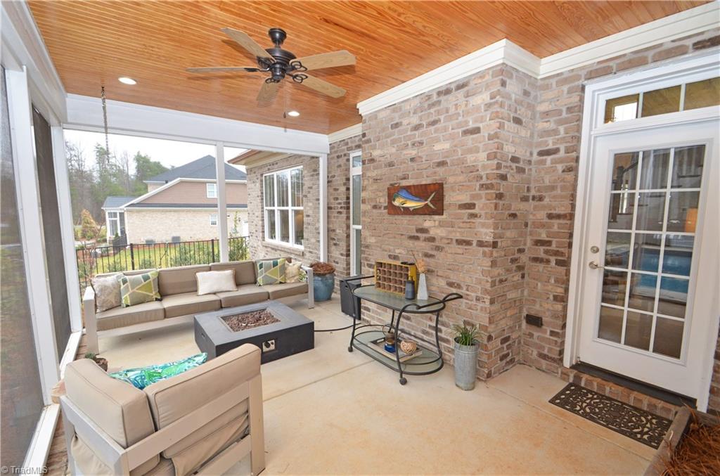 5578 Salem View Road Pfafftown, NC 27040 - Photo 20 of 48 Screened porch has a pine tongue and groove ceiling.