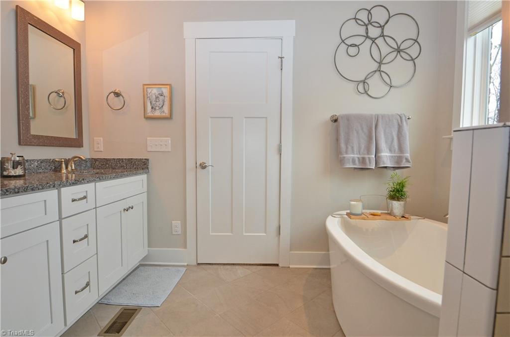 5578 Salem View Road Pfafftown, NC 27040 - Photo 23 of 48 Primary bathroom has dual sinks, soaking tub, large shower, and separate water closet.