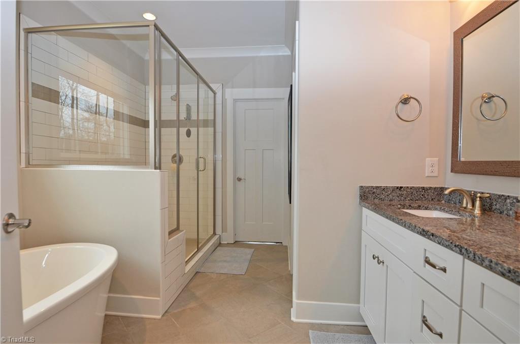5578 Salem View Road Pfafftown, NC 27040 - Photo 24 of 48 Large tiled shower and door leading to big walk-in closet.