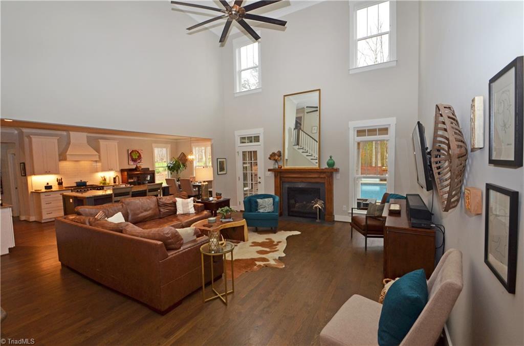 5578 Salem View Road Pfafftown, NC 27040 - Photo 8 of 48 Two story great room has door leading to screened porch.