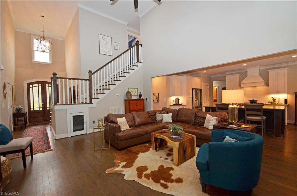 5578 Salem View Road Pfafftown, NC 27040 - Photo 10 of 48 Great room is open to the kitchen. Door under the stair landing is a clever home for your pet.