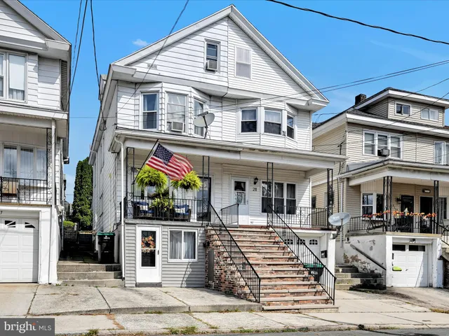 a front view of a house with a porch