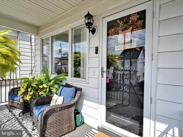 a outdoor living space with furniture and a potted plant
