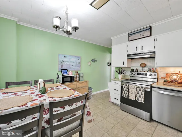 a kitchen with a table and cabinets