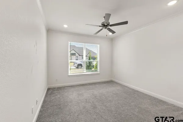 a view of a hallway with closet and wooden floor