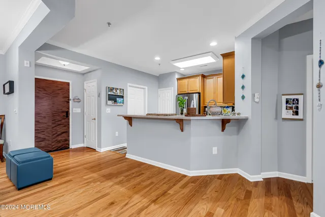 a kitchen with stainless steel appliances granite countertop a refrigerator stove and sink