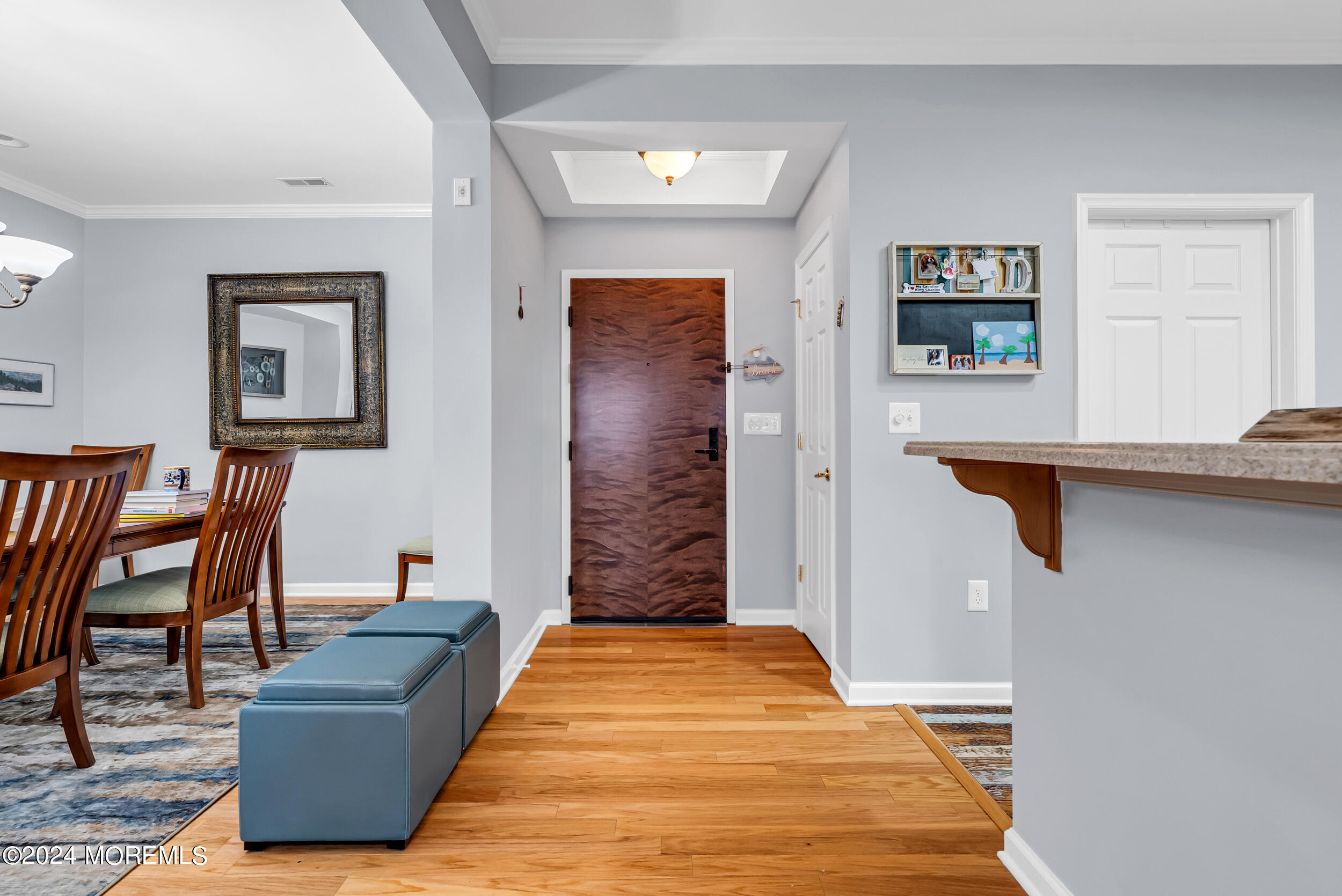 33 Cooper Avenue, Unit 215 Long Branch, NJ 07740 - Photo 13 of 27 a living room with furniture and a wooden floor