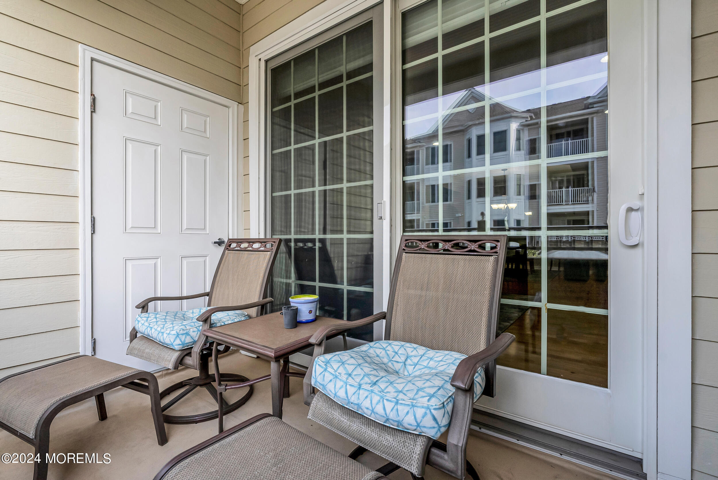 33 Cooper Avenue, Unit 215 Long Branch, NJ 07740 - Photo 17 of 27 a table and chair in a room and a window