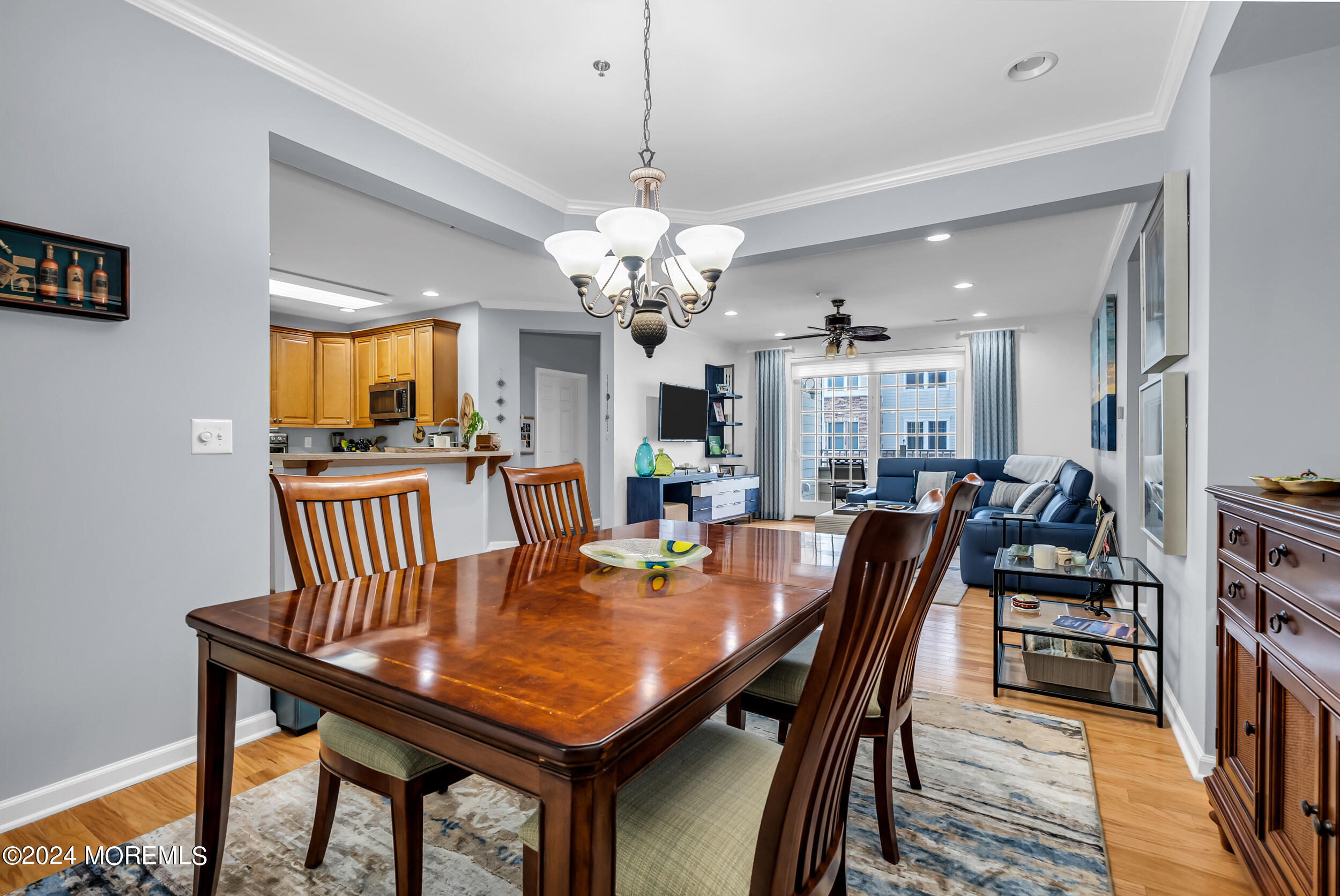 33 Cooper Avenue, Unit 215 Long Branch, NJ 07740 - Photo 18 of 27 a dining room with furniture and chandelier