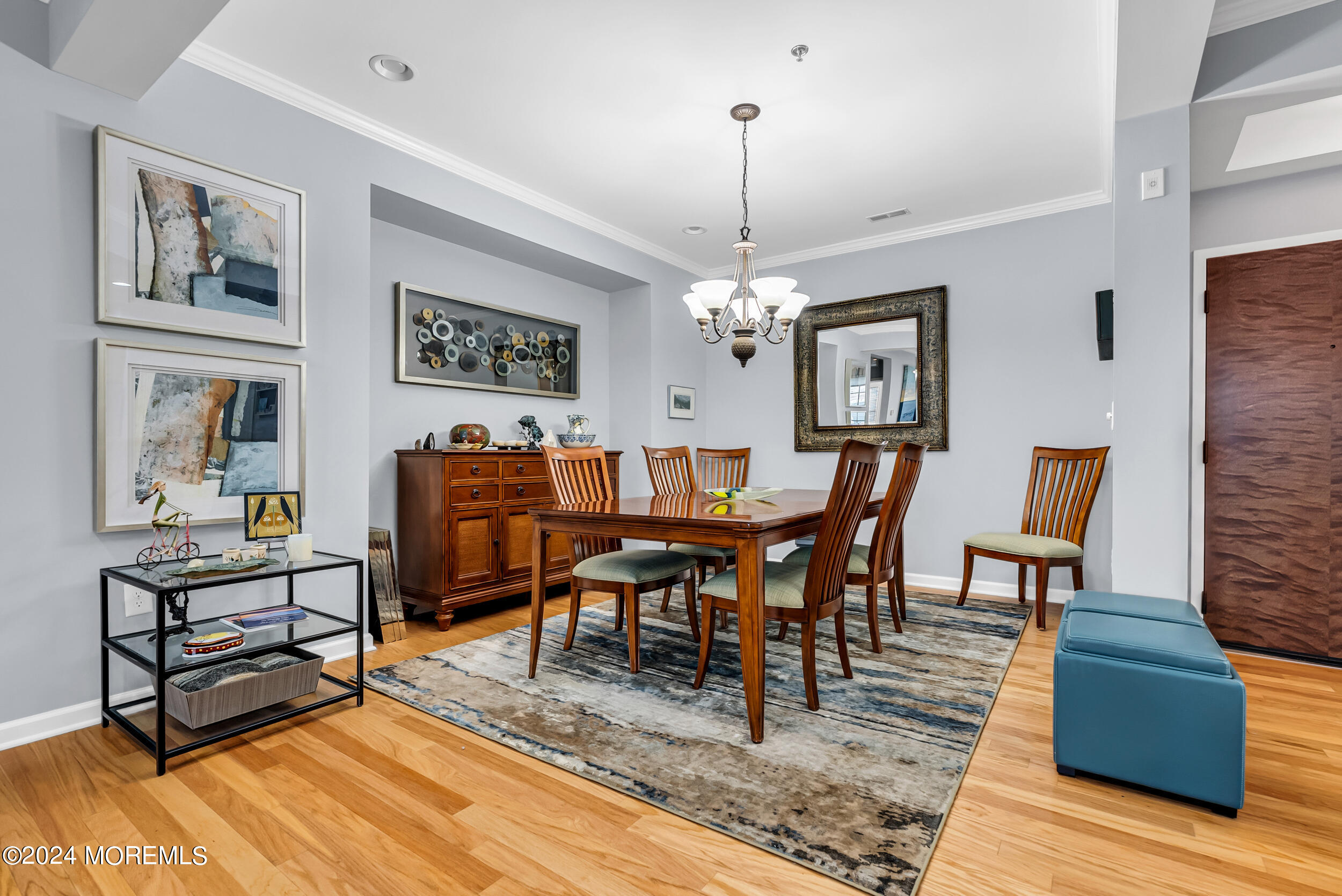 33 Cooper Avenue, Unit 215 Long Branch, NJ 07740 - Photo 19 of 27 a view of a dining room with furniture a rug and wooden floor