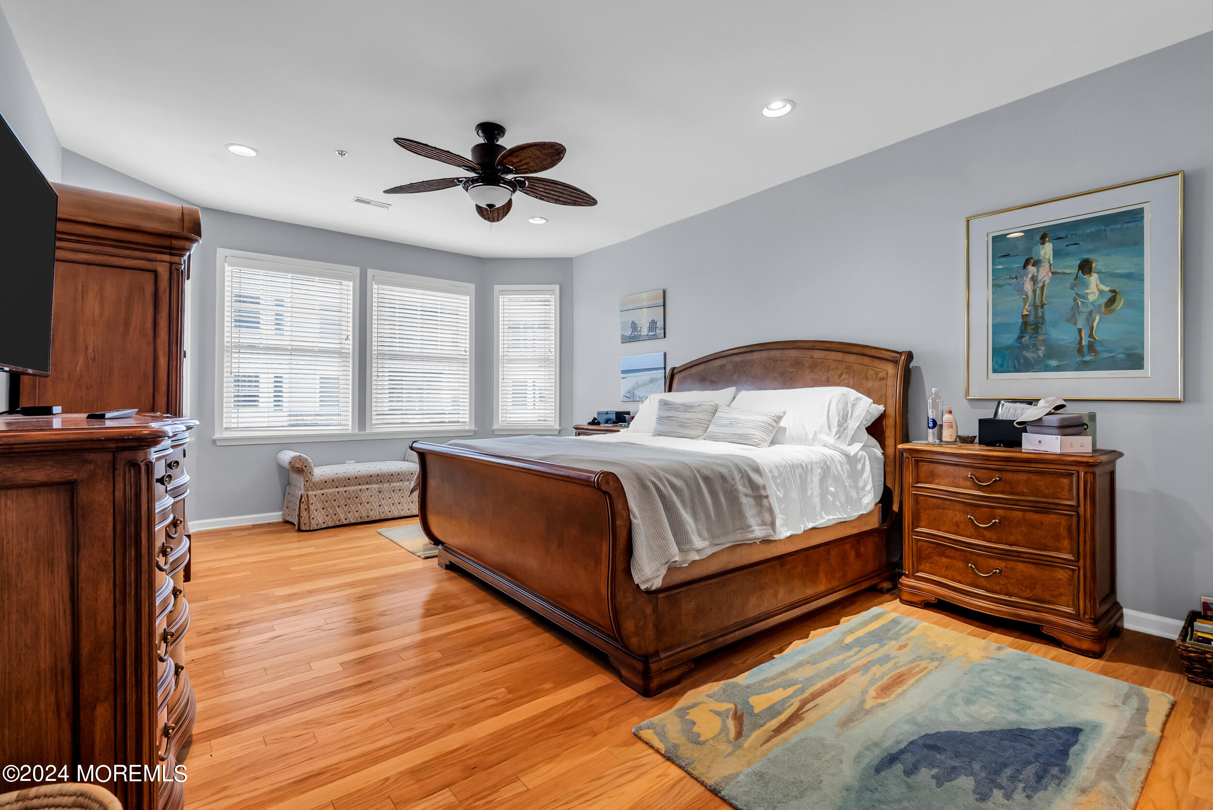 33 Cooper Avenue, Unit 215 Long Branch, NJ 07740 - Photo 20 of 27 a bedroom with a bed and a dresser next to a window