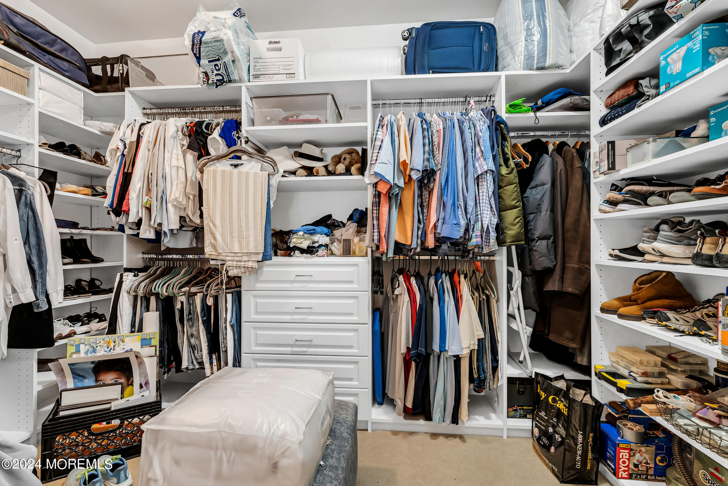 33 Cooper Avenue, Unit 215 Long Branch, NJ 07740 - Photo 23 of 27 a view of walk in closet with clothes and shoes