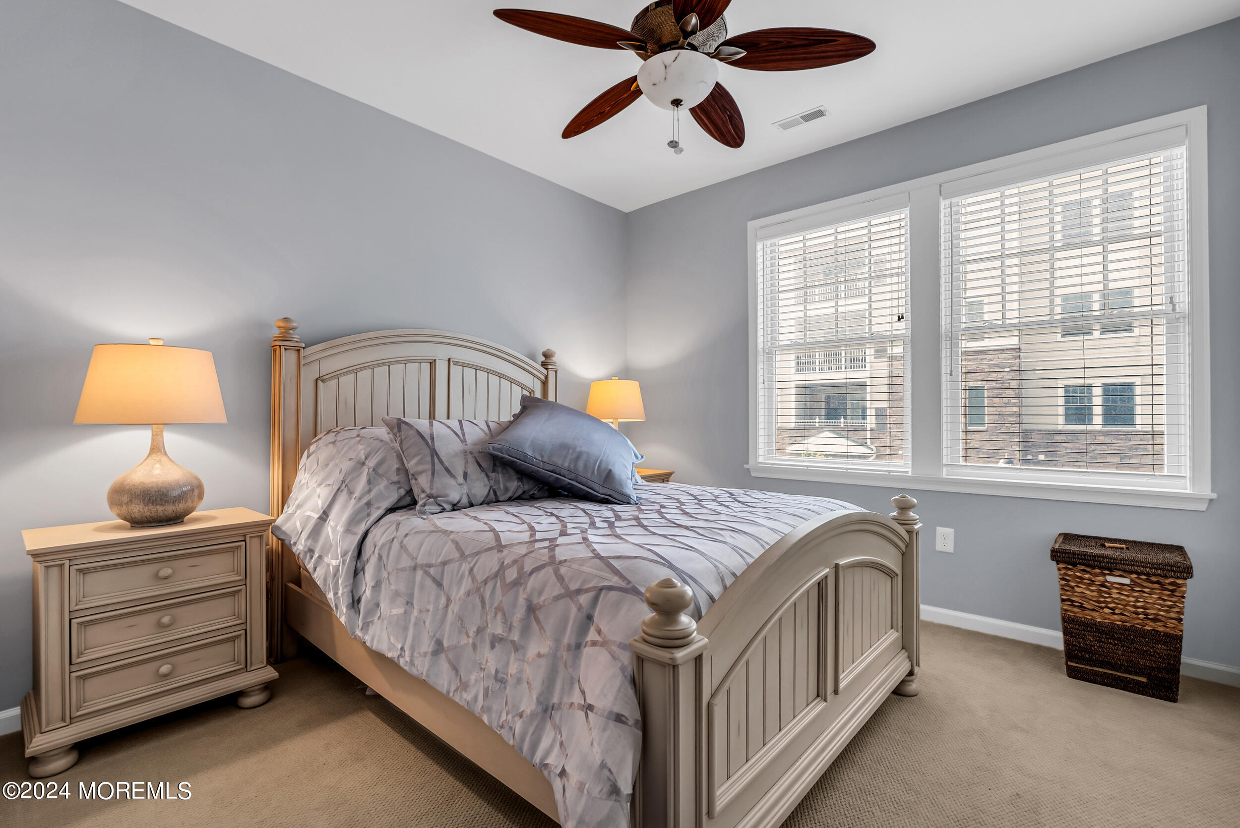 33 Cooper Avenue, Unit 215 Long Branch, NJ 07740 - Photo 24 of 27 a bedroom with a bed and wooden floor