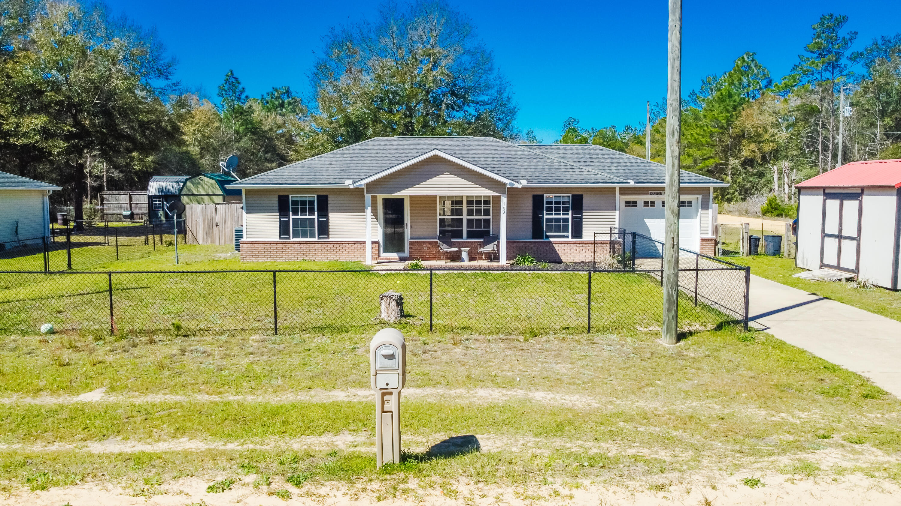 103 Valley View Drive DeFuniak Springs, FL 32433 - Photo 1 of 34 a house view with a swimming pool