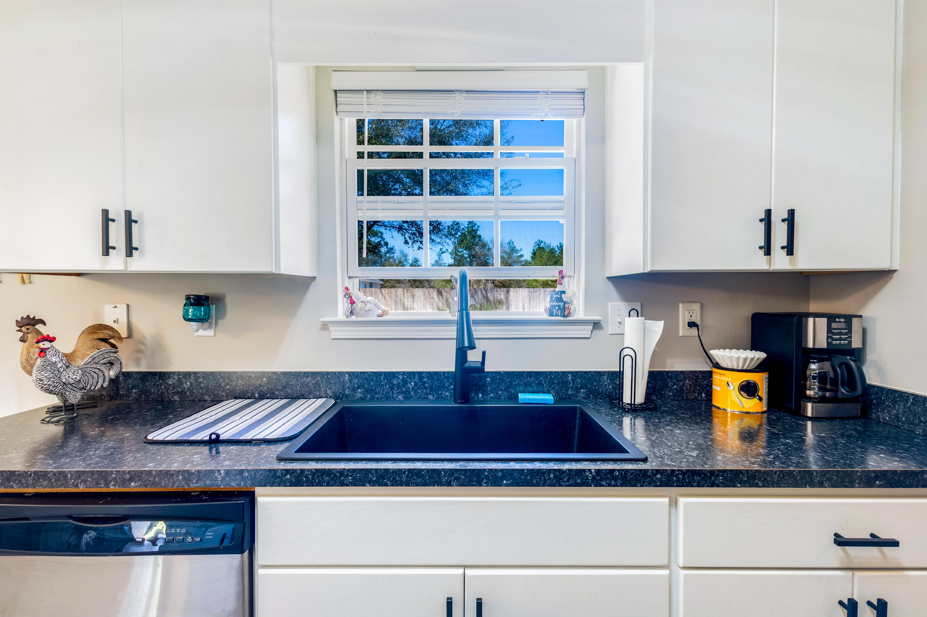 103 Valley View Drive DeFuniak Springs, FL 32433 - Photo 15 of 34 a kitchen with a counter top space and cabinets